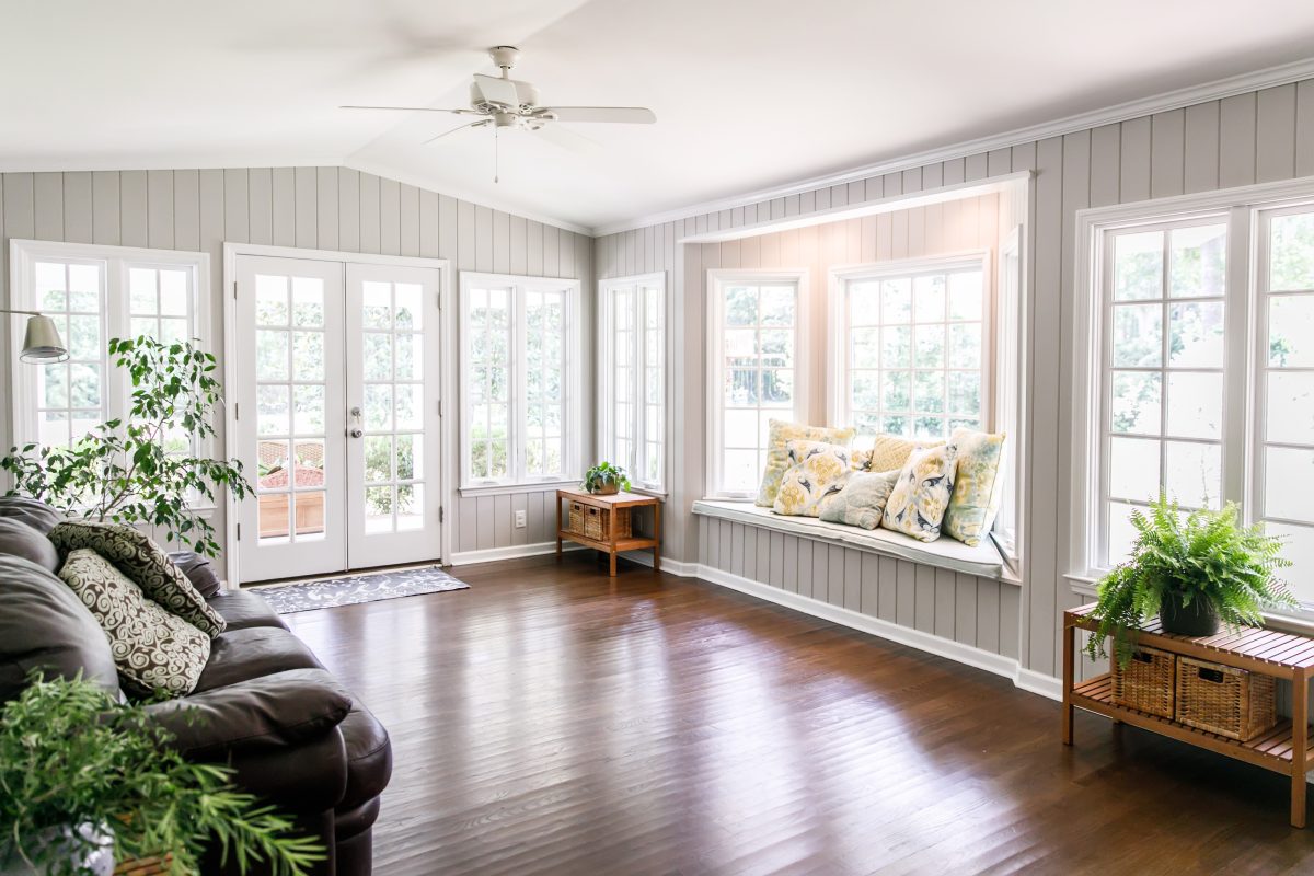 Large and open living room den sun room with windows on two side